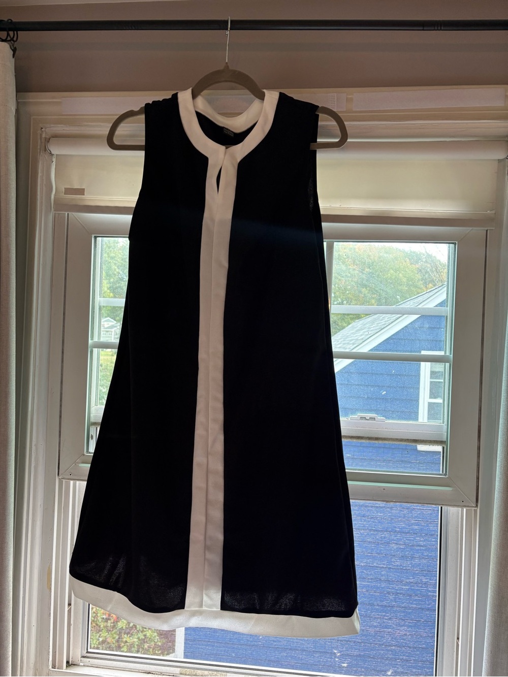 Sleeveless Black Dress with White Trim